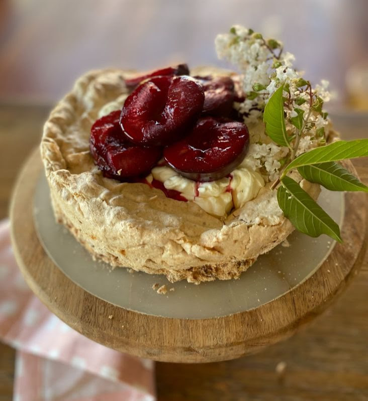 Pistachio Meringue Cake with Roasted Plums and Mascarpone Cream